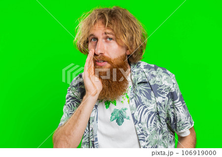Young man whisper news rumors holding hands near mouth, share gossip, quiet, keep my secrets Young man whisper news rumors holding hands near mouth, share gossip, quiet, keep my secrets 106919000