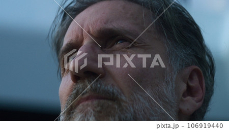 Tired medic takes off glasses, rests after shift 106919440