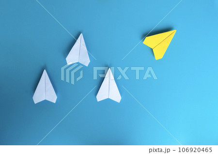 Top view of white and yellow paper airplane. With space for text. Top view of white and yellow paper airplane. With space for text. 106920465