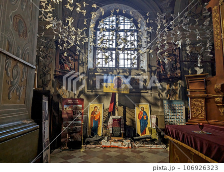 July 2023. Ukraine. Lviv. People brought paper birds and doves to the temple - a symbol of peace. We ask God for peace in Ukraine Decoration of one of the churches in Lviv. July 2023. Ukraine. Lviv. People brought paper birds and doves to the temple - a symbol of peace. We ask God for peace in Ukraine Decoration of one of the churches in Lviv. 106926323