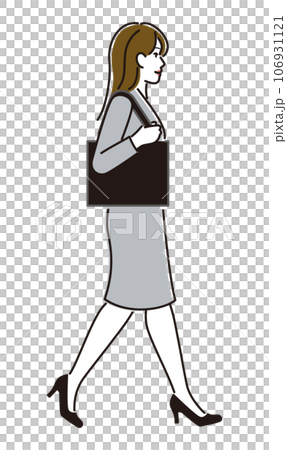 A woman in a suit walking with a bag 106931121