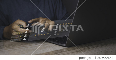 Businessman giving high score with five golden stars rating satisfaction in service. 106933471