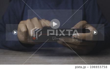 Person watching video on internet with an imaginary video player service. 106933758