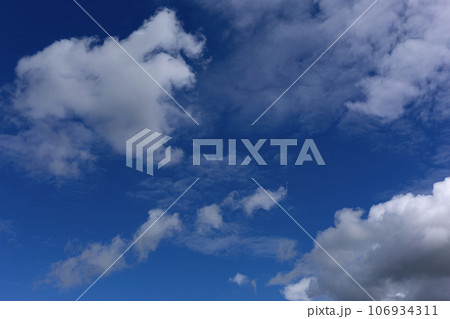 Stratocumulus Clouds on Blue Sky Background. 106934311