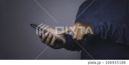 Young man using smartphone. Young man using smartphone. 106935186