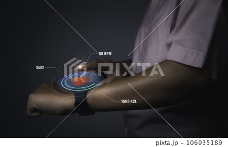 Man using smart watch technology checking heart rate. 106935189