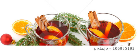 Mulled wine, fruits and spices isolated on a white. Wide photo. Mulled wine, fruits and spices isolated on a white. Wide photo. 106935193