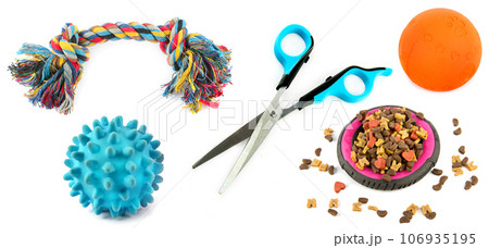 Dry food, Scissors and toys for pet on isolated white. Wide photo. Collage. Dry food, Scissors and toys for pet on isolated white. Wide photo. Collage. 106935195