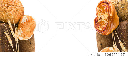 Bread, sweet buns and ears of wheat isolated on white. Wide photo. Free space for text. Collage. Bread, sweet buns and ears of wheat isolated on white. Wide photo. Free space for text. Collage. 106935197