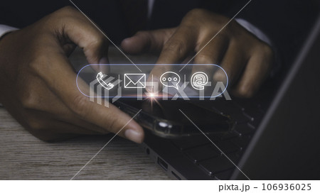 Businessman access contact connect online by smartphone with contact icons. 106936025