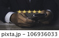 Businessman giving high score five golden stars rating satisfaction in service. 106936033
