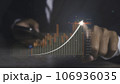 Stock market graph with man using phone financial profit stock development. 106936035