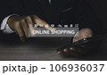Businessman using mobile phone shopping online with icons E-commerce marketing. 106936037