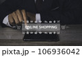 Businessman using mobile phone shopping online with icons E-commerce marketing. 106936042