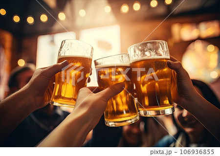 Hands of people with beer in their hands, celebrating, outdoor 106936855