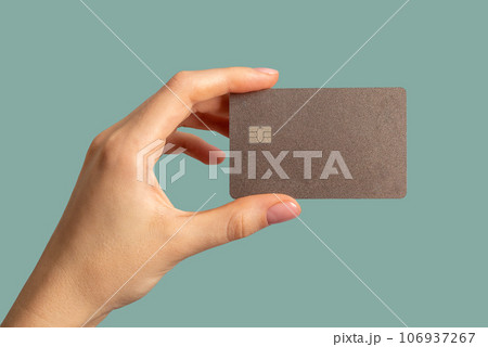 Hands holding bank card mock up, plastic mockup Hands holding bank card mock up, plastic mockup 106937267