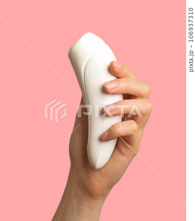 Female hand holding women sex toy, masturbating item 106937310