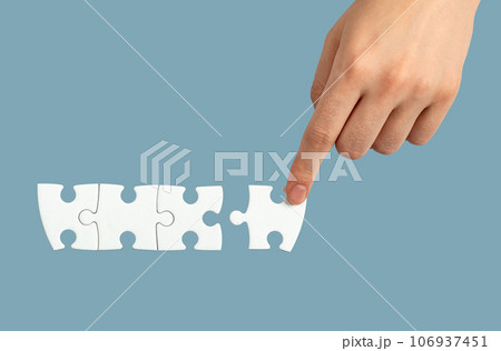 Hand connecting, adding puzzle piece, final touch concept 106937451