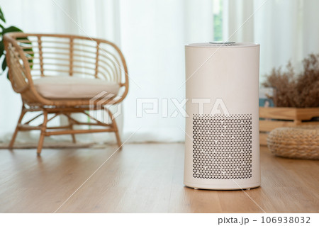 Air purifier in cozy white bed room for filter and cleaning removing dust PM2.5 HEPA in home,for fresh air and healthy life,Air Pollution Concept Air purifier in cozy white bed room for filter and cleaning removing dust PM2.5 HEPA in home,for fresh air and healthy life,Air Pollution Concept 106938032
