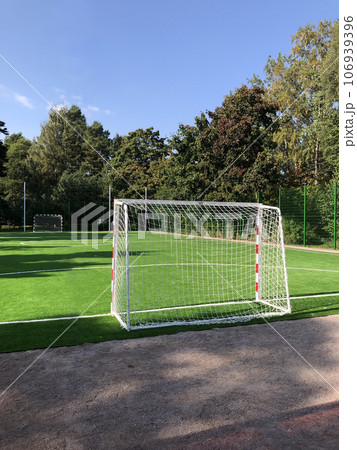 empty football field, gates in the foreground 106939396