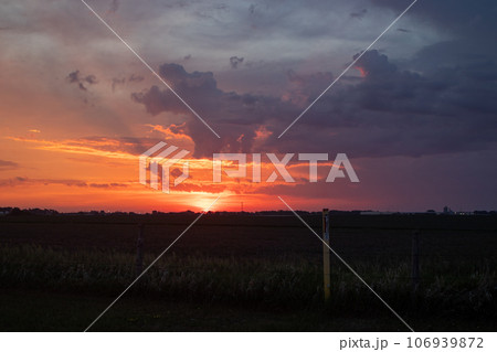 Bright Orange sunrise over Nebraska corn field 106939872