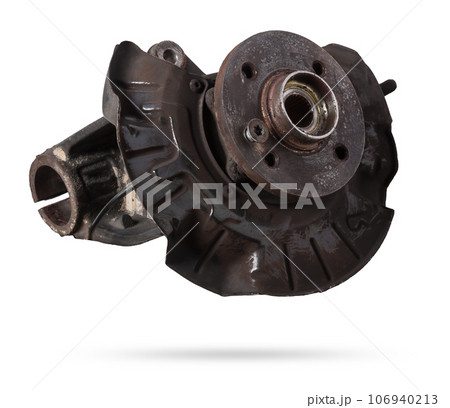 A close-up of a worn metal wheel hub with oil and rust elements on a white background. Seasonal undercarriage repair and replacement of brake system parts in a workshop. 106940213