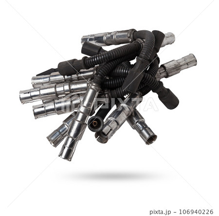 Black ignition wire of a high voltage for spark plug on blue and red background. Car spare parts catalog. Top view. 106940226