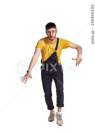 Full-length portrait of a funny guy dancing in studio isolated on white background. Full-length portrait of a funny guy dancing in studio isolated on white background. 106940398