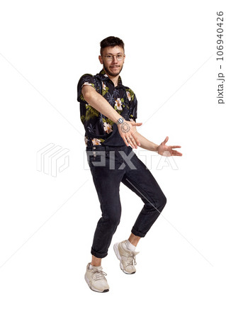 Full-length portrait of a funny guy dancing in studio isolated on white background. Full-length portrait of a funny guy dancing in studio isolated on white background. 106940426