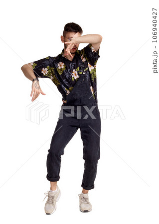 Full-length portrait of a funny guy dancing in studio isolated on white background. Full-length portrait of a funny guy dancing in studio isolated on white background. 106940427