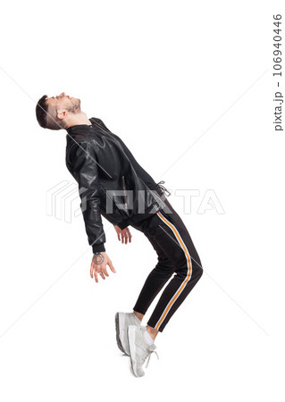 Full-length photo of a funny guy dancing in studio isolated on white background. Full-length photo of a funny guy dancing in studio isolated on white background. 106940446