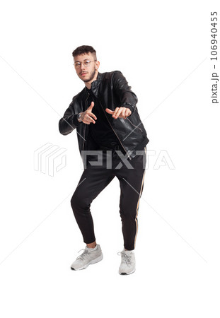 Full-length photo of a funny guy dancing in studio isolated on white background. Full-length photo of a funny guy dancing in studio isolated on white background. 106940455