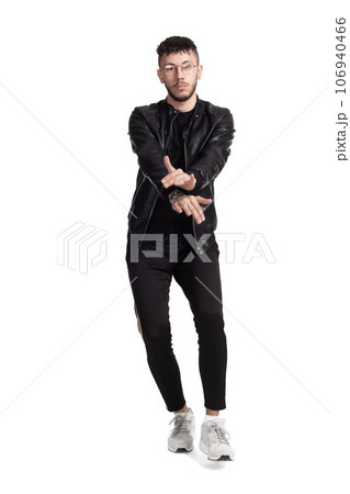 Full-length photo of a funny guy dancing in studio isolated on white background. Full-length photo of a funny guy dancing in studio isolated on white background. 106940466