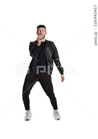 Full-length photo of a funny guy dancing in studio isolated on white background. 106940467