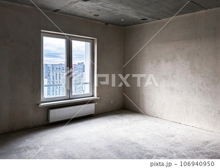 Empty unfurnished apartment, flat with concrete walls, window, new urban condominium Empty unfurnished apartment, flat with concrete walls, window, new urban condominium 106940950