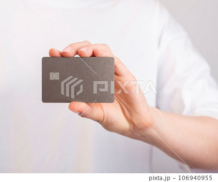 Hand holding bank card mockup, bankcard with chip Hand holding bank card mockup, bankcard with chip 106940955