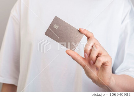 Plastic bank card mockup in hand 106940983