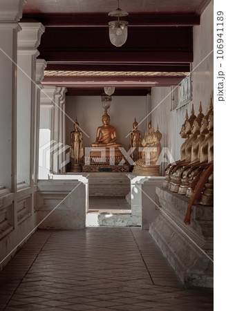 Diminishing perspective interior view at corridor around the Wat yai suwannaram temple is leading to Buddha statue. Diminishing perspective interior view at corridor around the Wat yai suwannaram temple is leading to Buddha statue. 106941189