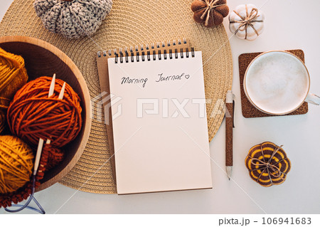 Morning Journal, Journaling Techniques Tips for Writing Morning Pages. Open notebook with text Morning Journal, coffee cup, pen and decor on table Morning Journal, Journaling Techniques Tips for Writing Morning Pages. Open notebook with text Morning Journal, coffee cup, pen and decor on table 106941683