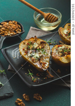 Baked Pears with Blue Cheese, Walnuts and Honey 106942191