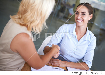 Happy, women and handshake of business people, deal and networking in negotiation, meeting and consulting. Partnership, collaboration and shaking hands for congratulations, hiring and sales agreement 106942755