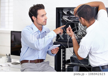 Hardware, information technology and engineering professional men repair motherboard in server room. Manufacturing or service, maintenance or technician and male coworkers support in office. 106942823