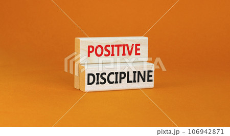 Positive discipline symbol. Concept words Positive discipline on beautiful wooden blocks. Beautiful orange table orange background. Business psychology positive discipline concept. Copy space. 106942871