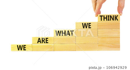 We are what we think symbol. Concept word We are what we think on wooden block. Beautiful white table white background. Businessman hand. Business We are what we think concept. Copy space. 106942929