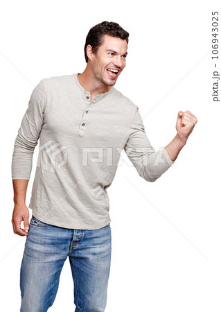 Happy, man and promotion in celebration for winning, discount or goal against a white studio background. Isolated male model winner with smile celebrating win, sale or achievement on mockup 106943025