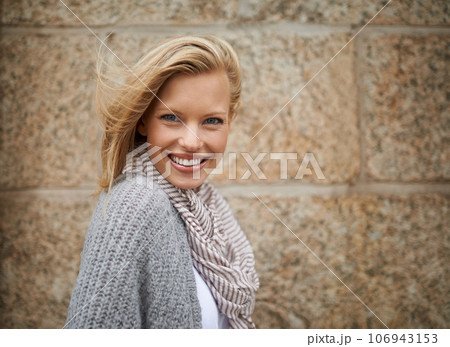 Warm and stylish. Cropped portrait of a pretty young blonde in warm winter fashion. 106943153