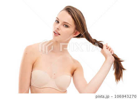 Beauty, hair and salon with portrait of woman for cosmetics, fashion and luxury treatment. Isolated, hair care and shine with face of girl for keratin, glow and self care in white background studio 106943270