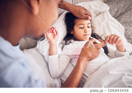 Thermometer, nursing and a man with a sick child for a fever, temperature check or virus. Family, house and a dad with a medical tool and a girl kid in the bed with a health problem or headache 106943456