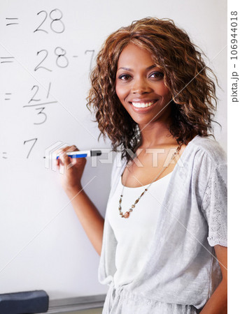 Mathematics, teacher and portrait of black woman on whiteboard with pride for career or job in classroom. Smile, education and female educator on board from South Africa teaching math at school. 106944018
