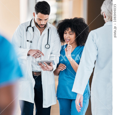 Tablet, medical and doctor and nurse planning schedule online, internet and web together in a hospital or clinic. Strategy, healthcare and professional or team working together on a medicine app 106944035